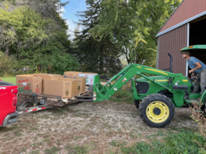 Unloading winter squash with a tractor